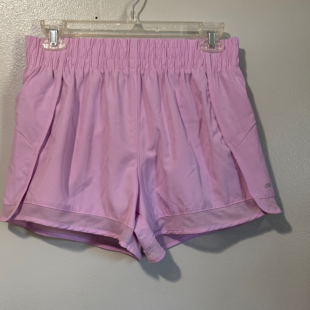 LEG3ND Purple women’s running shorts with liner and zipper pocket.